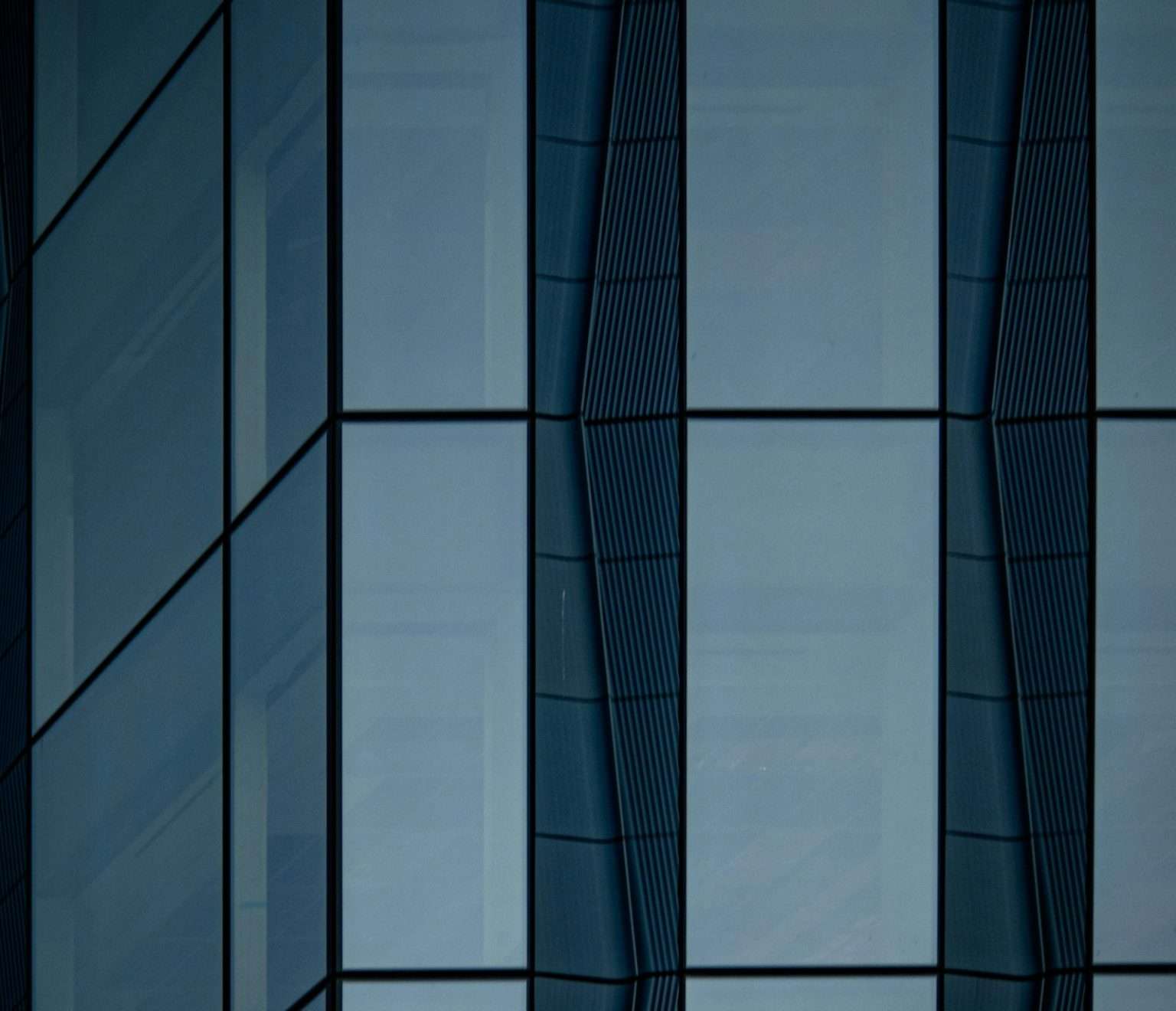 Dark glass curtain wall in close detail